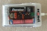 (A 1.5 volt (AAA battery) am receiver in a transparent plastic box)